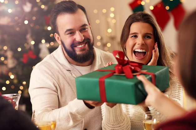 group of friends celebrating Christmas at home