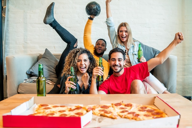 Premium Photo | Group of friends celebrating victory while watching a match  together. friends and sports concept.