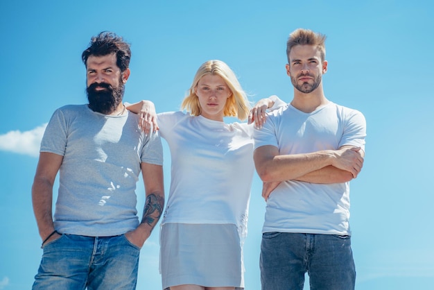 Group of friends at clear sky background happy friends vacation young team on blue background isolat