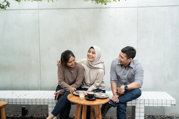 Group of friends enjoying in cafe together