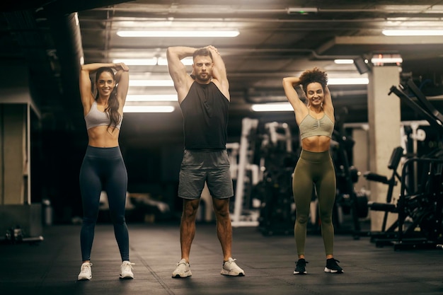 Group of friends exercising in a gym