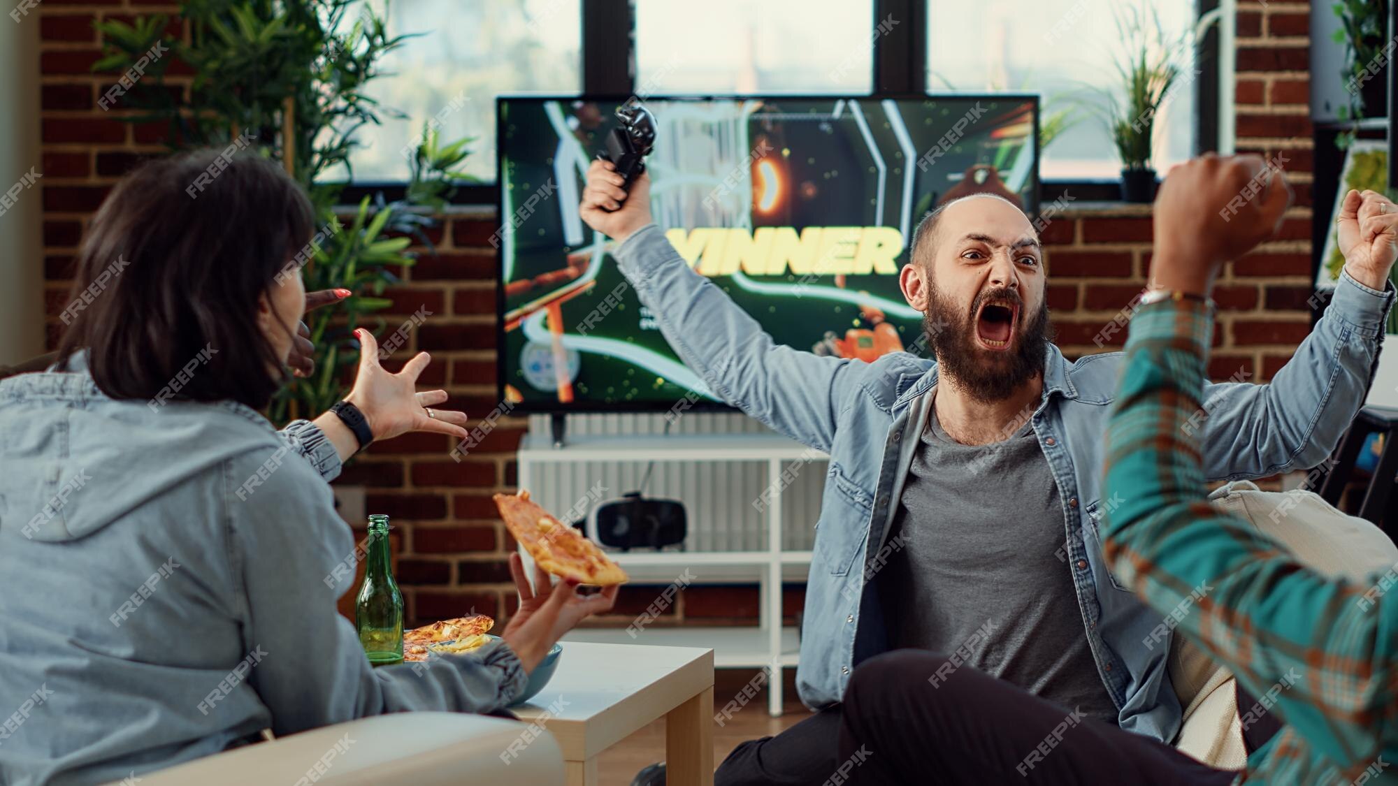 Premium Photo  Excited gamers friends playing video games at home