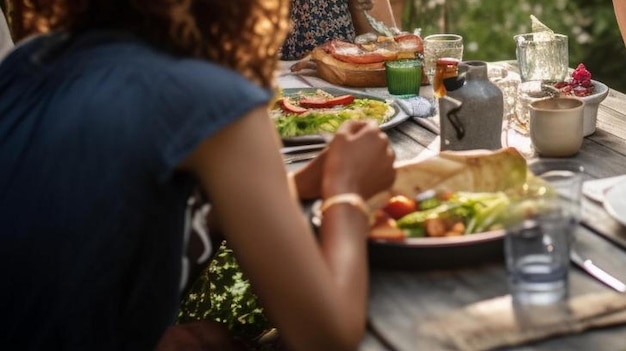 Photo group of friends gathered around a table in a garden on a summer afternoon to share a meal and have