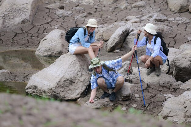 Photo a group of friends going hiking in the streams of the tropical forest area