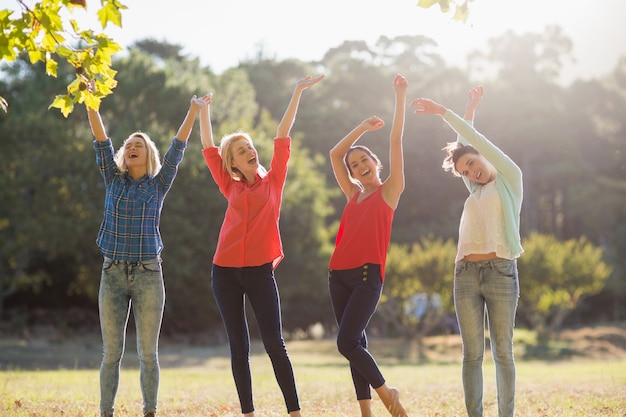 Group of friends having fun in park