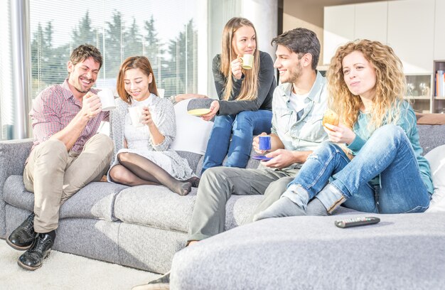 Group of friends having fun and spending time together at home
