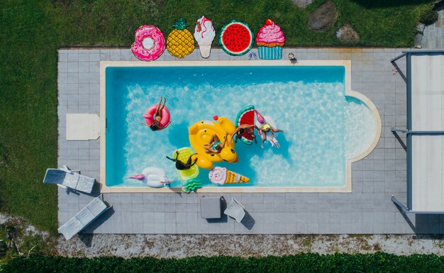 group of friends having fun in the swimming pool