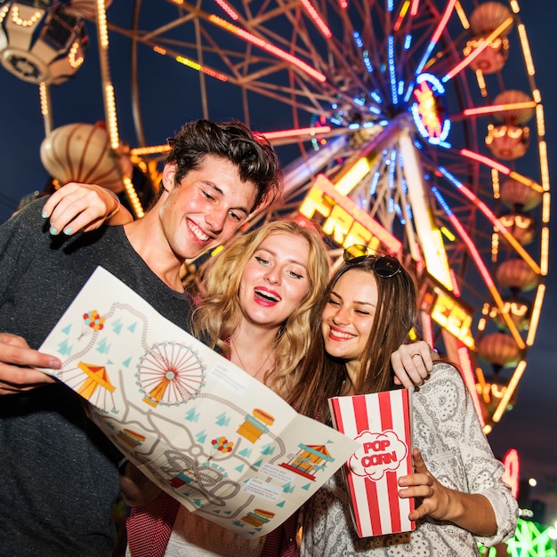 A group of friends is enjoying the amusement park