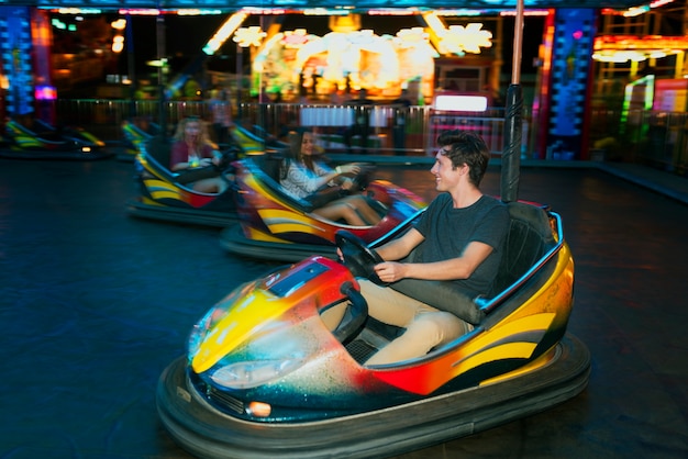 A group of friends is enjoying the amusement park