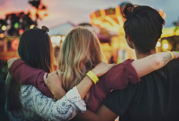 A group of friends is enjoying amusement park