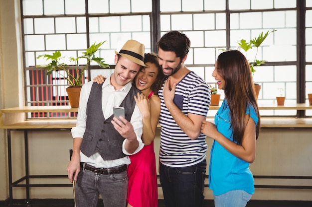 Group of friends looking at a smartphone