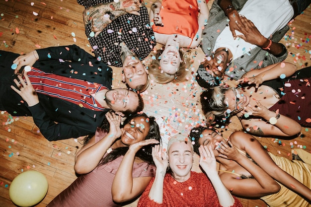 Group of friends lying on the floor at a party