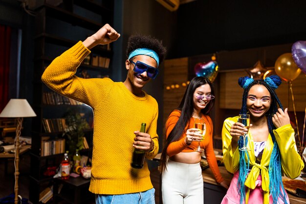 Group of friends making party at home on new year evening