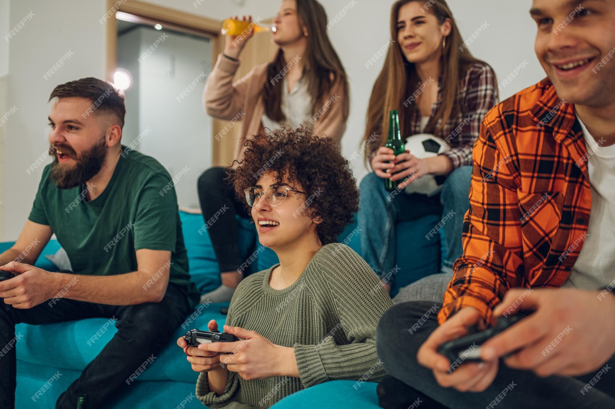 Premium Photo  Excited gamers friends playing video games at home