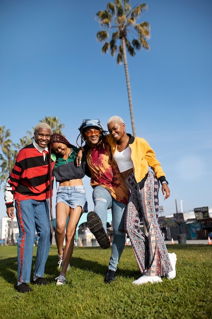 Group of friends posing outside in the park