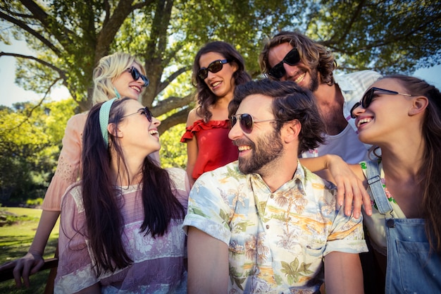 Group of friends smiling in park