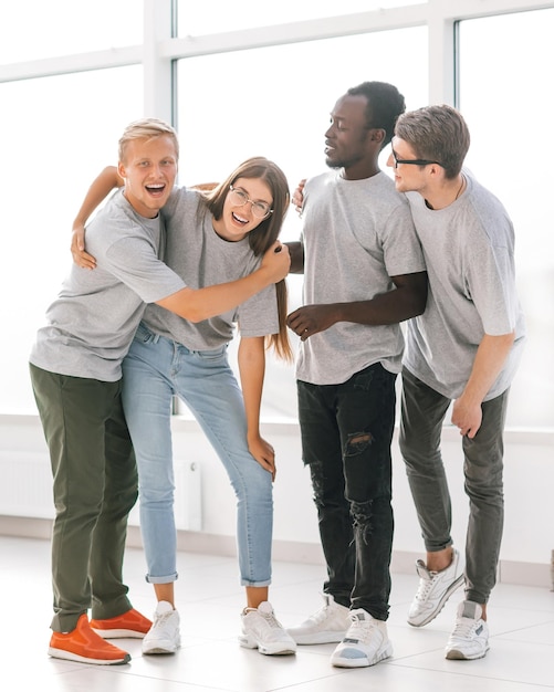 Group of friends standing in a bright spacious hall