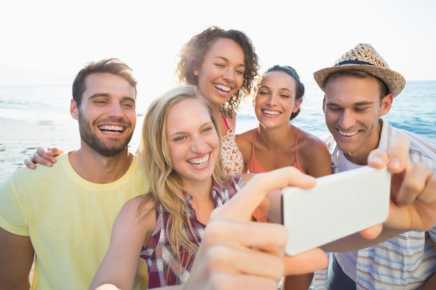 group of friends taking selfies 