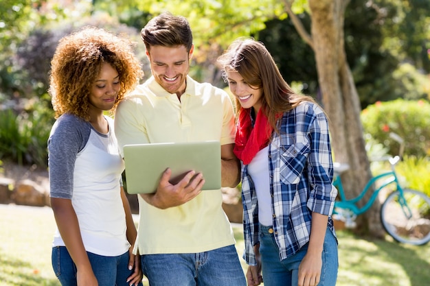 Group of friends using laptop