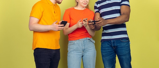 Group of friends using mobile smartphones