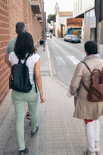 Group of friends walking together through the city