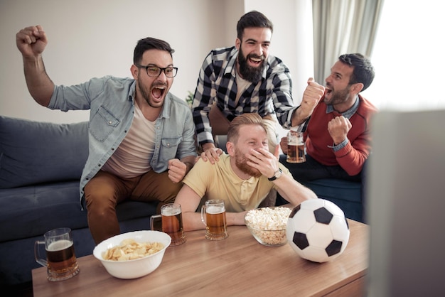 Group of friends watching sport together