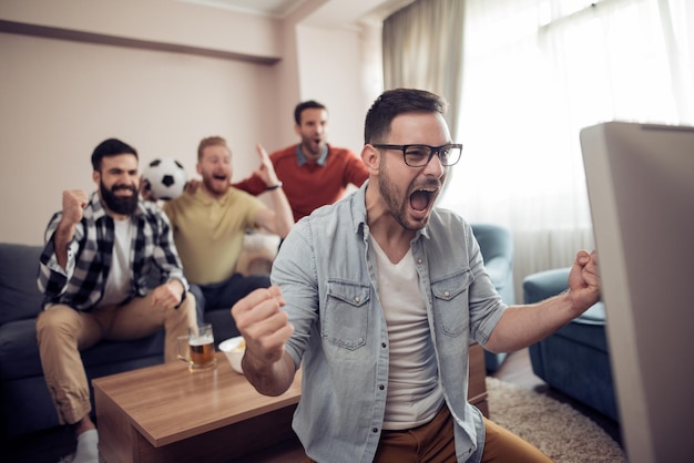 Group of friends watching sport together