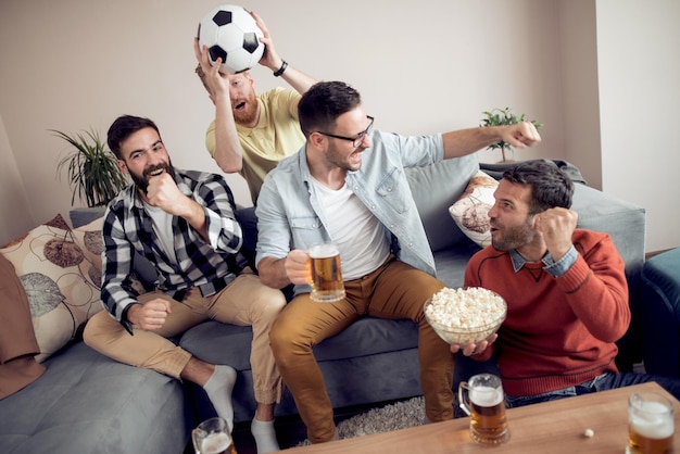 Group of friends watching sport together