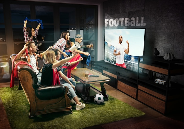 Group of friends watching TV match championship sport games Emotional men