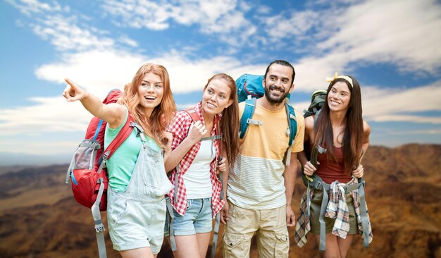 group of friends with backpacks at grand canyon