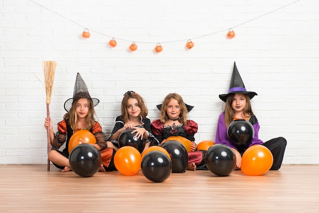 Group of friends with costumes of vampires and witches for halloween holidays