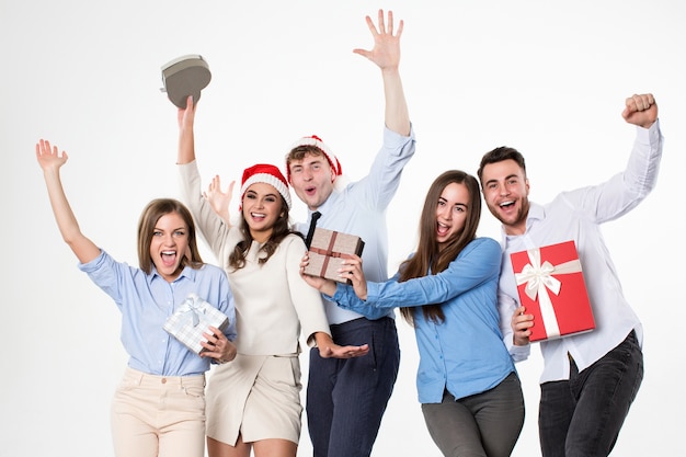 Group of friends with gifts in hands fun on a white background
