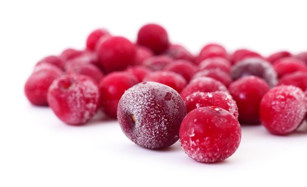 Group of frozen cherries on a white background