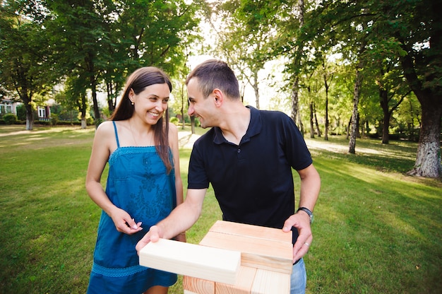 Group game of physical skill with big blocks.