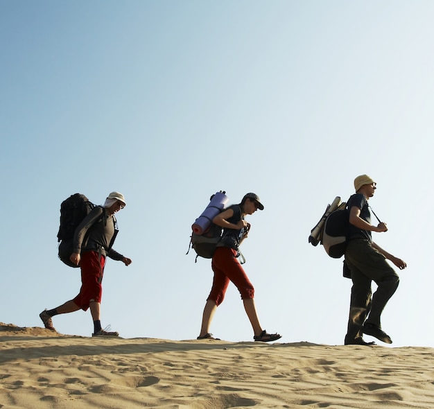 Group going in sand desert