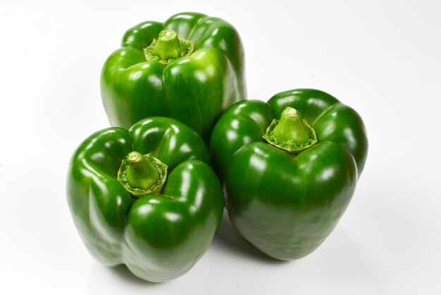 Group of green bell peppers isolated on white background