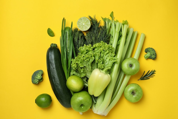 Photo group of green vegetables on yellow