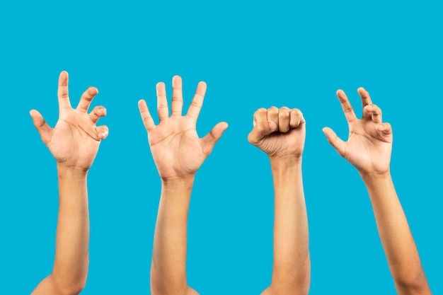 Group of hand gestures isolated over the blue background