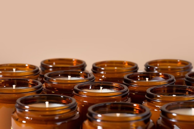 Group of Handmade Soy and coconut wax candles in a Amber and opaque container brown glass jar Natural eco friendly organic candles Trendy concept diy Vegan plastic free product Copy space