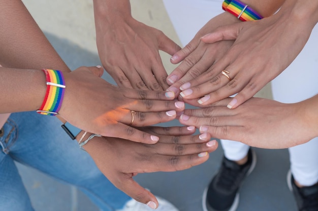 Photo group of hands together with lgtb handles femininity concept