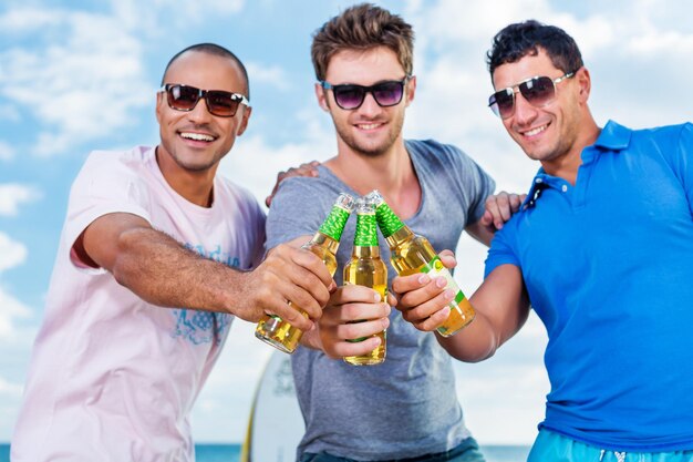 Group of  happy Boys Cheering at Beach