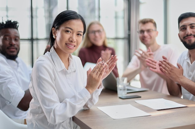 Group of happy business colleague in a meeting together at office