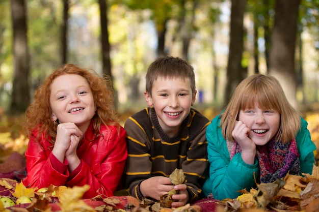 A group of happy children in the autumn park