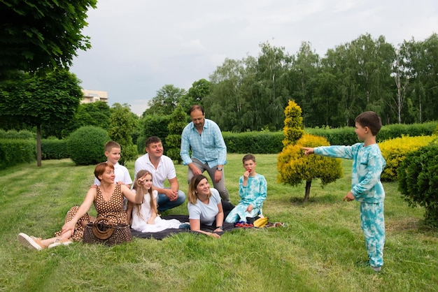 group of happy family with children at park