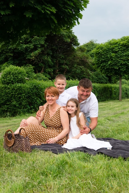 group of happy family with children at park