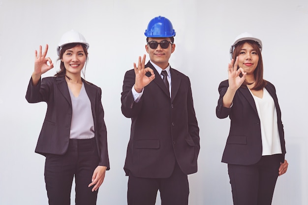 Group of happy foreman people showing ok gesture 