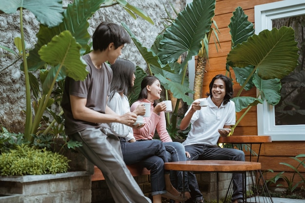 Group of happy friends having fun in the garden,trendy young people enjoying time together