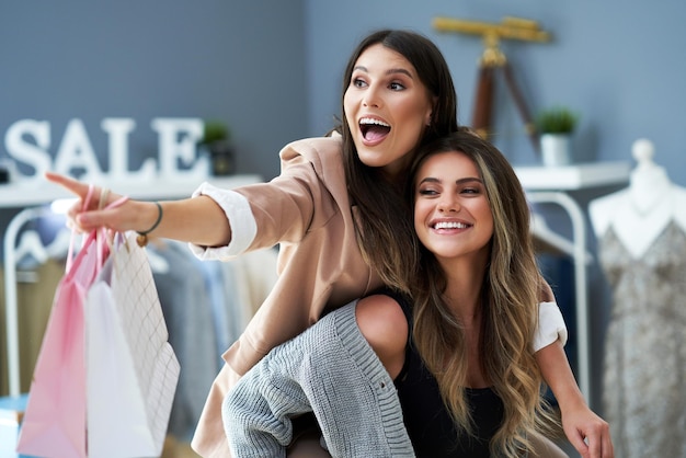 Group of happy friends during shopping. High quality photo