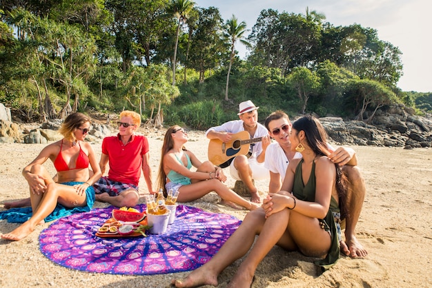 Group of happy friends on a tropical island