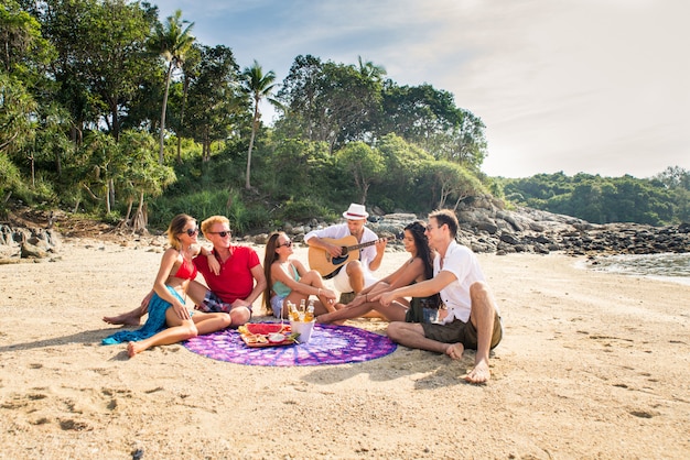 Group of happy friends on a tropical island